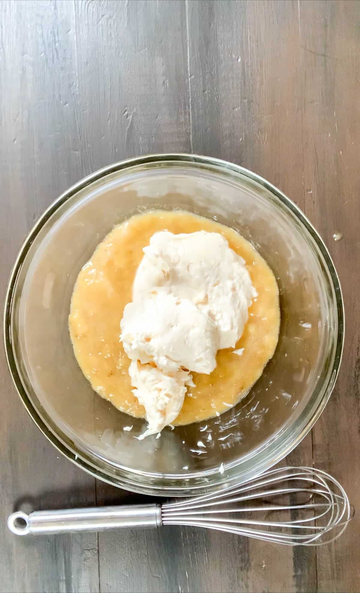 mayonnaise in the bowl with mashed bananas.