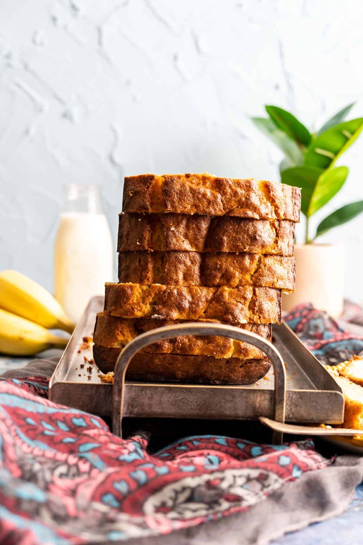 slices of the banana bread on a gray plate.